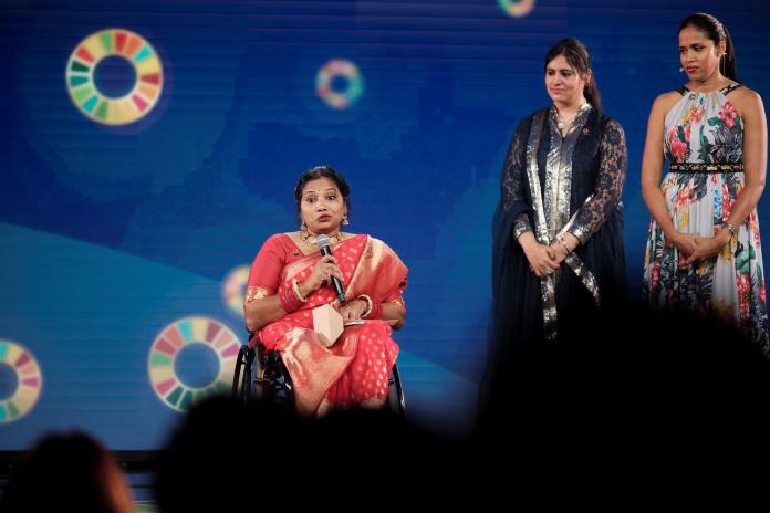 Suvarna Raj makes a speech on stage