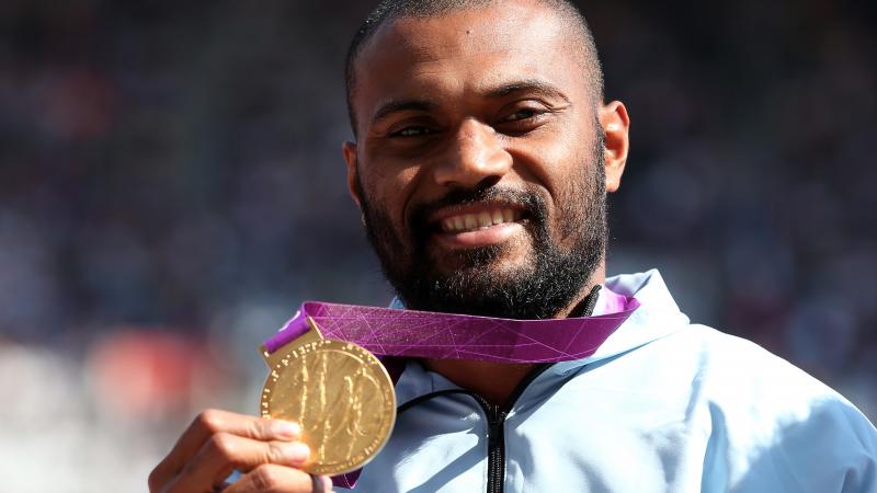 A picture of a man with a medal around his neck