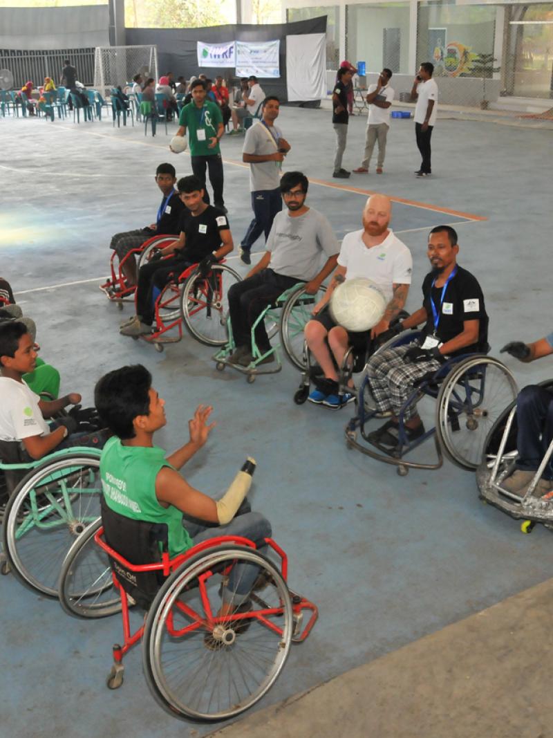 Men in wheelchairs line up for a drill
