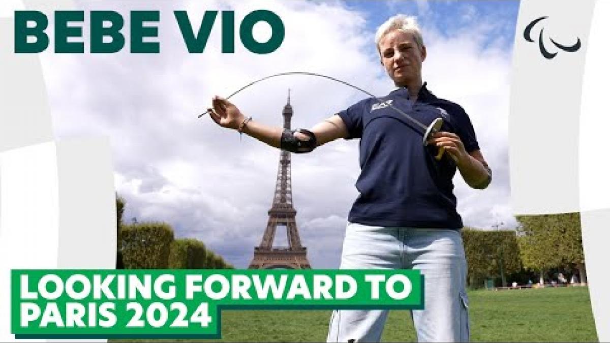 Italian wheelchair fencing athlete Bebe Vio poses with her fencing sword in front of the Eiffel Tower in Paris