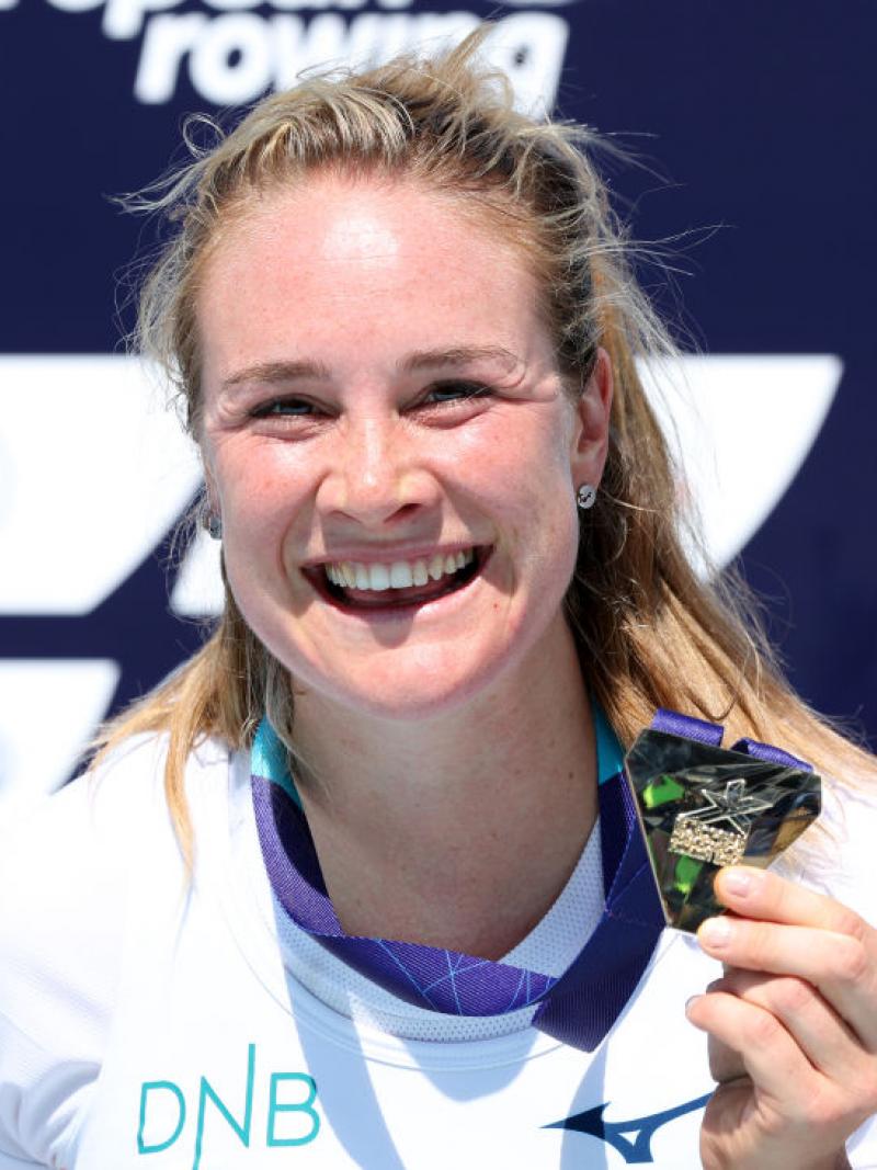 Para rower Birgit Skarstein smiling and holding a gold medal 