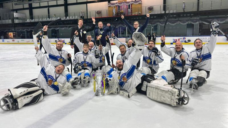 Finland Para ice hockey national team celebrating on an ice rink