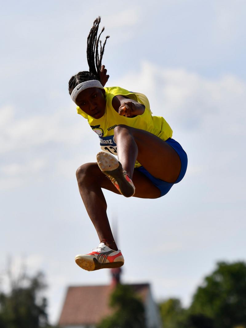 Ecuadorian athlete Kiara Rodriguez flies in the air after her jump