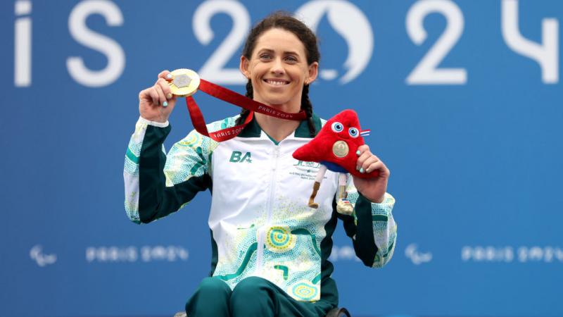 Lauren Parker poses for a photo after receiving a gold medal