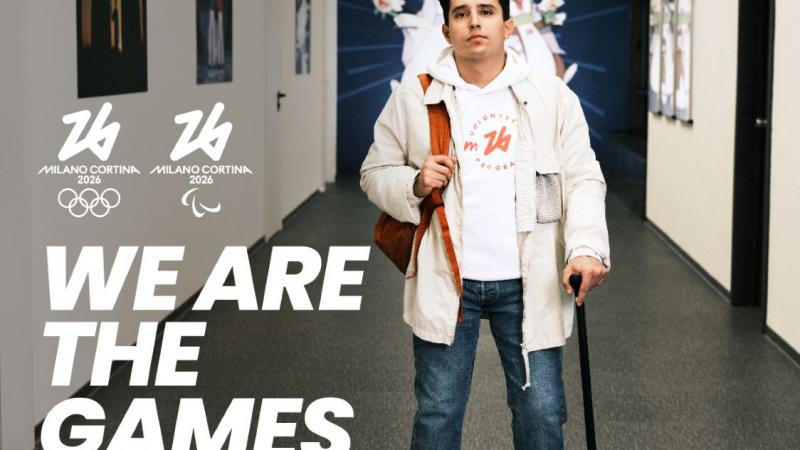 The sentence "We Are the Games" and the logos of Milano Cortina 2026 in front of a photograph of a man