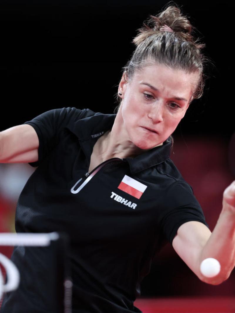 Woman returns ball in table tennis