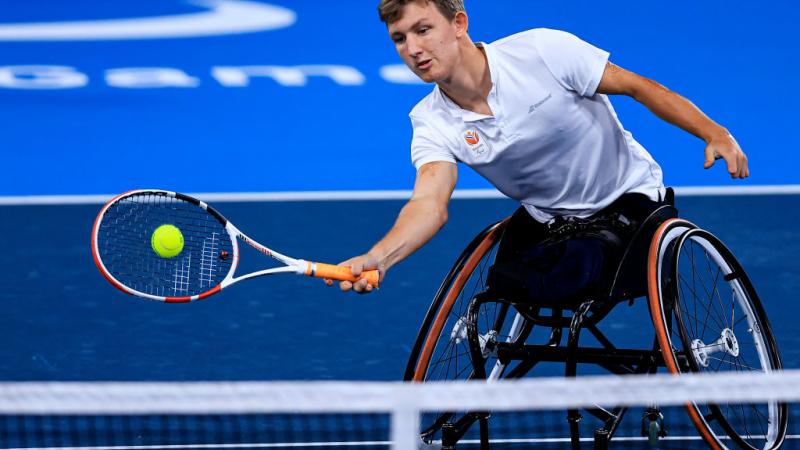 A male wheelchair tennis player in action at the Tokyo 2020 Paralympics