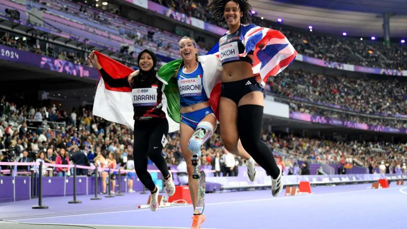 Athletes celebrate their medal