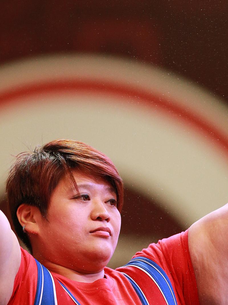 Chinese Taipei's powerlifter Tzu-Hui Lin raises her arms