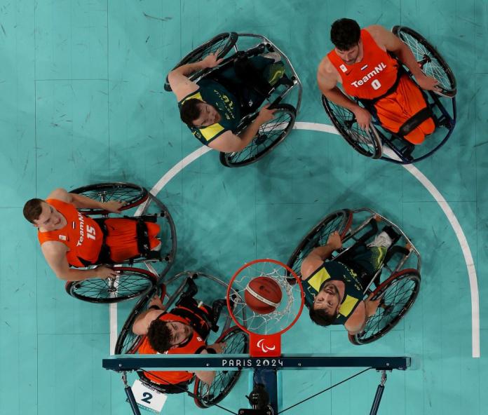 A wheelchair basketball photo taken from above the hoop