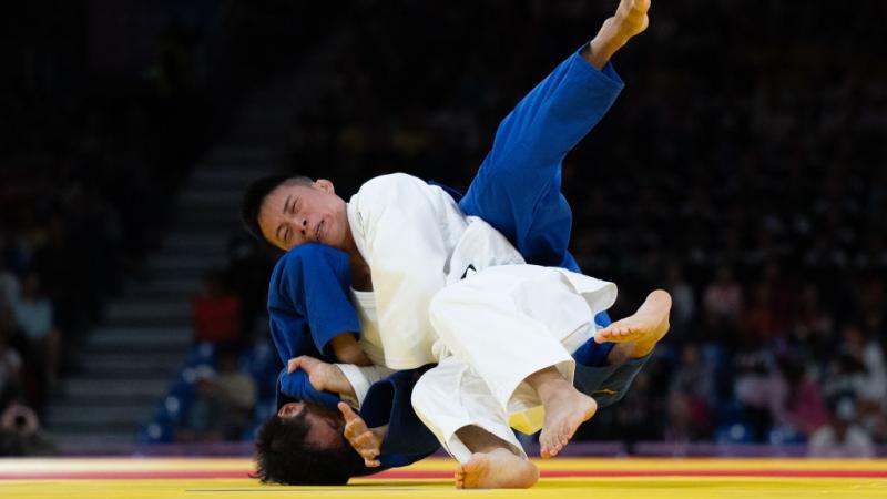 Two judo athletes fighting in a bout