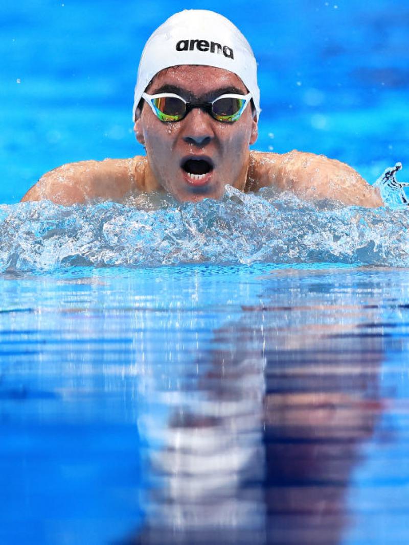A male Para swimmer competes